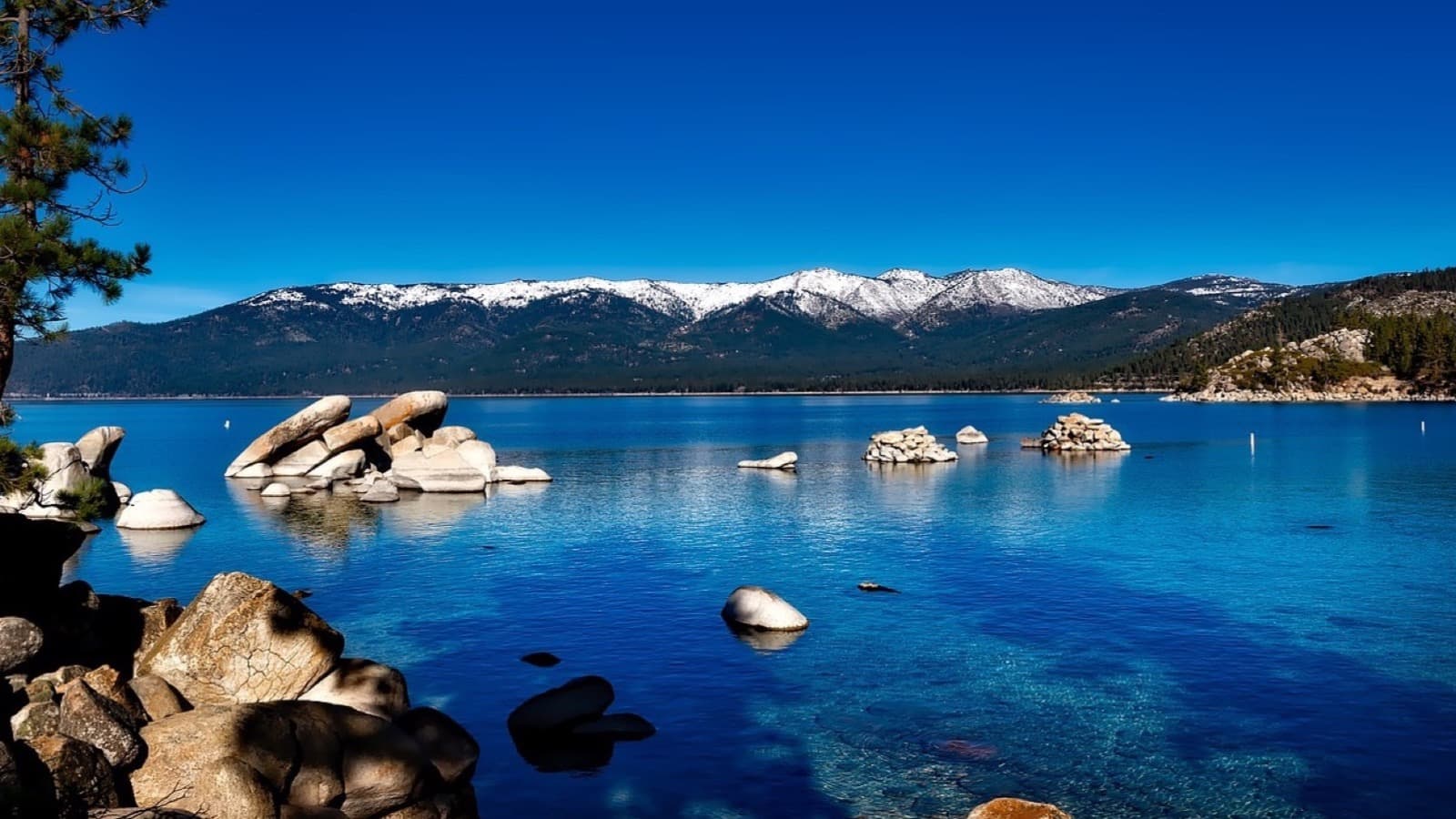 Lake Tahoe Nevada shoreline with crystal-clear alpine water and Sierra Nevada mountains — moving to Lake Tahoe Nevada relocation guide 2026