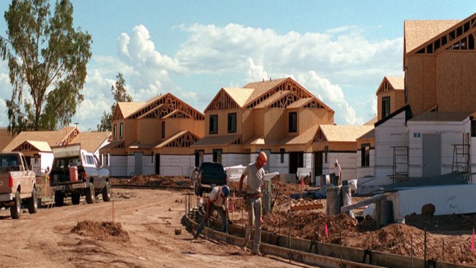 New construction home buying process in Las Vegas with a buyer reviewing builder plans and specifications