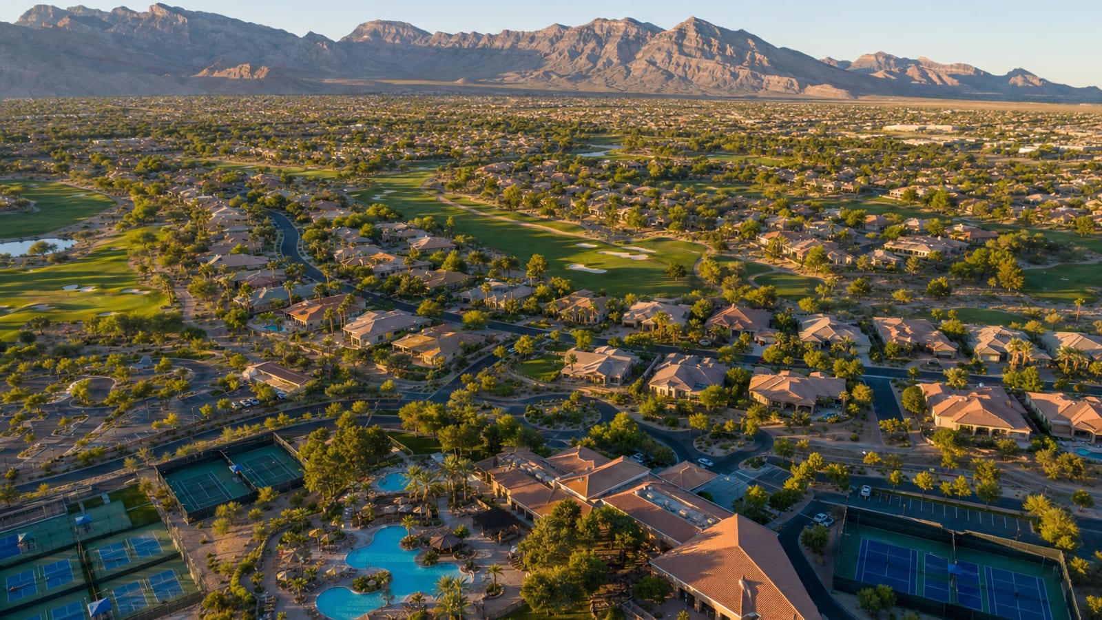 Sun City Summerlin aerial showing three golf courses Highland Falls Palm Valley and Eagle Crest weaving through the active adult community