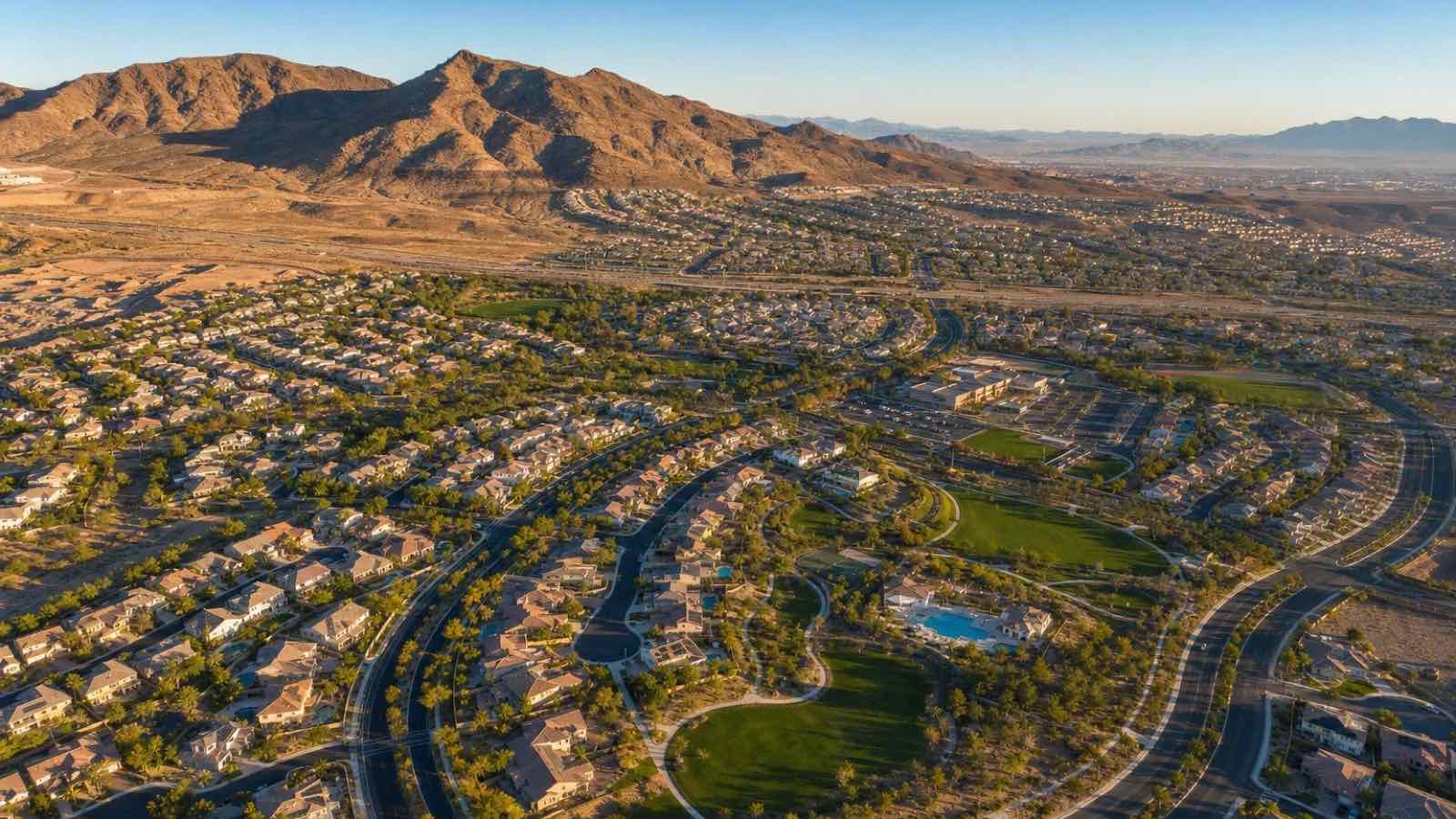 Aerial view of Anthem master-planned community in Henderson with golf course and Black Mountain backdrop, a destination for Arizona and Texas relocators